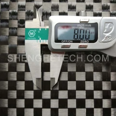 Stretch woven carbon fabric