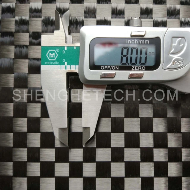 Stretch woven carbon fabric
